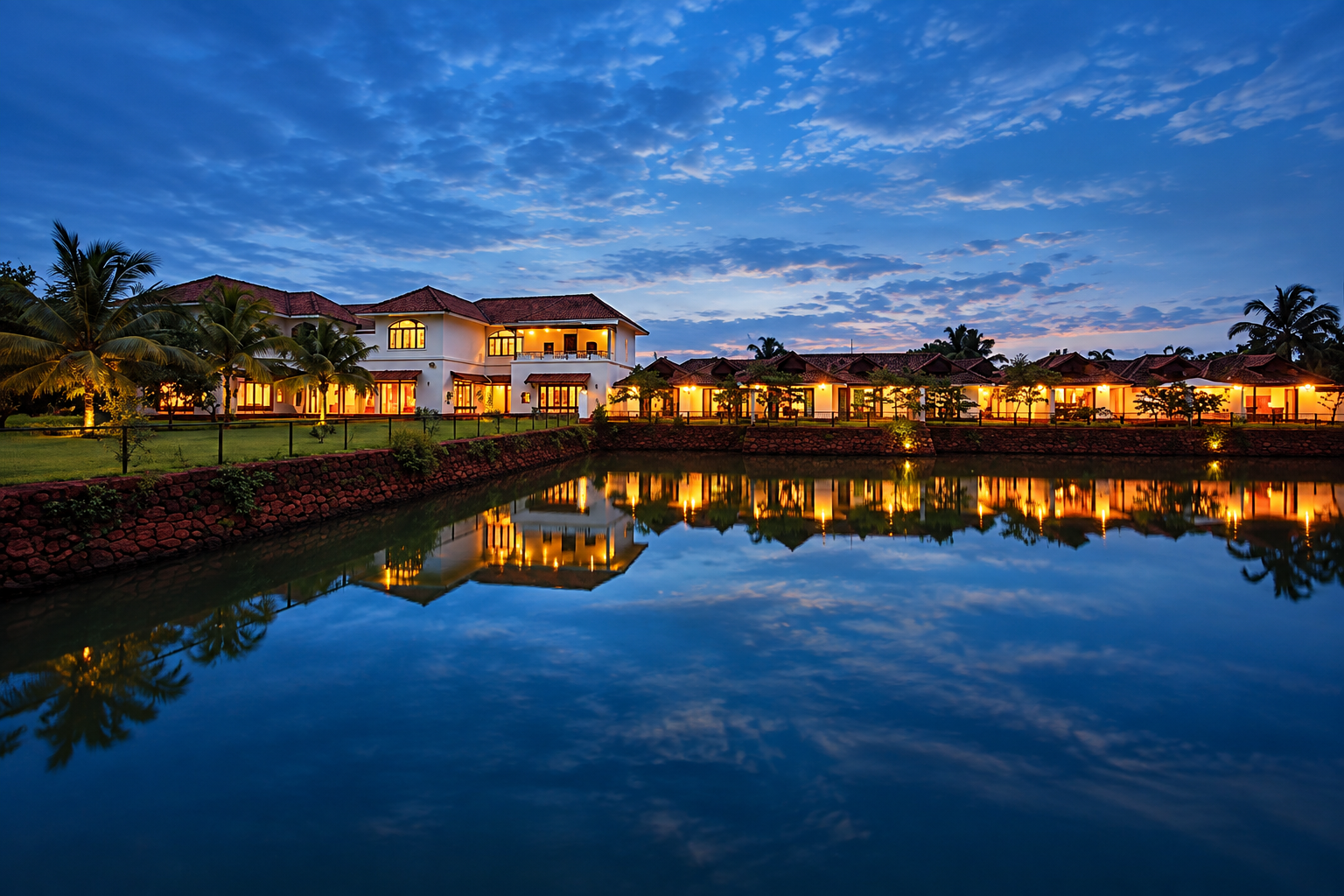Rajah Island at night, its lantern-lit buildings reflected in the still backwaters
